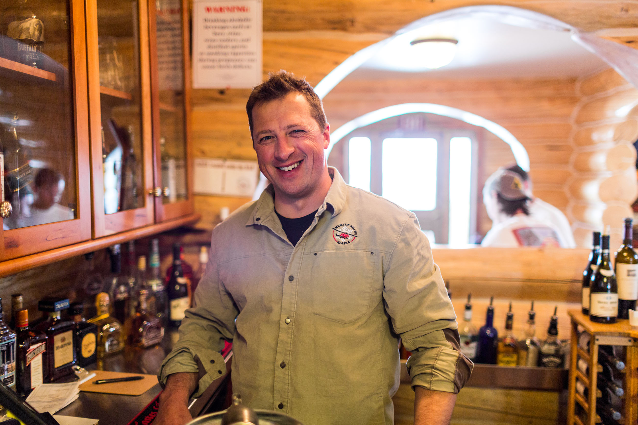 Njord standing behind the bar at Majestic Heli Ski